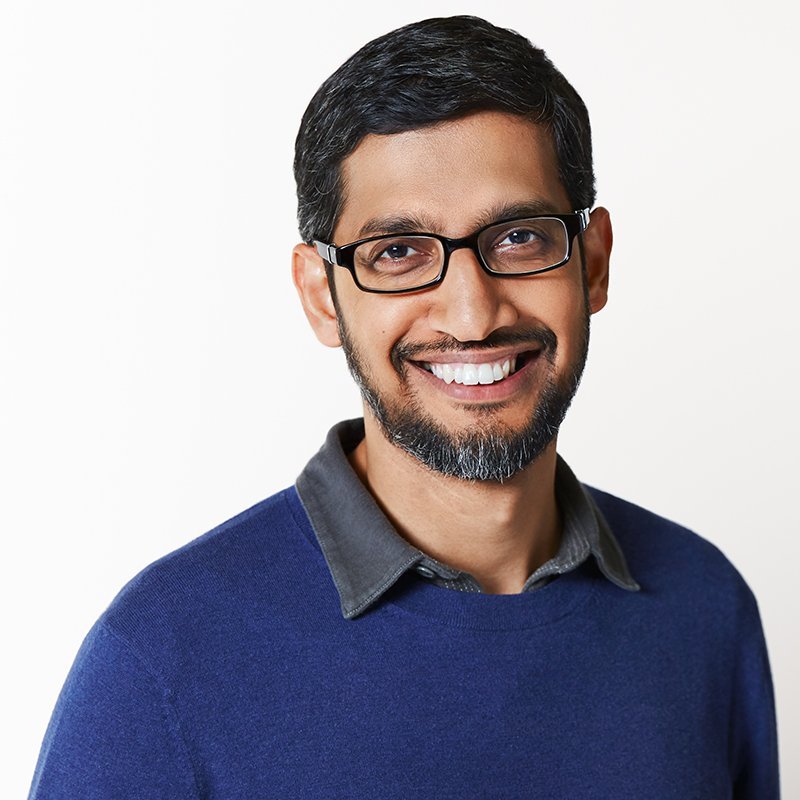 Sundar Pichai CEO of Alphabet standing beside the Google G logo with electric blue AI neural network lines connecting them
