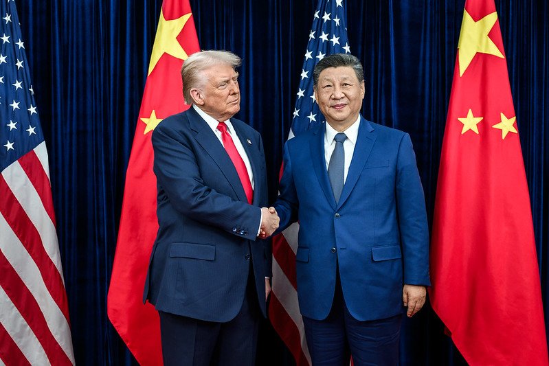 Trump greets Xi Jinping before their October 2025 Busan summit meeting at Gimhae International Airport