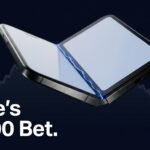 Apple iPhone Duo foldable smartphone half-open, showing dual OLED displays, titanium hinge, and Touch ID side button